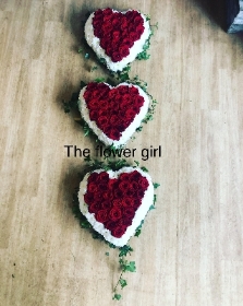 Three linked hearts